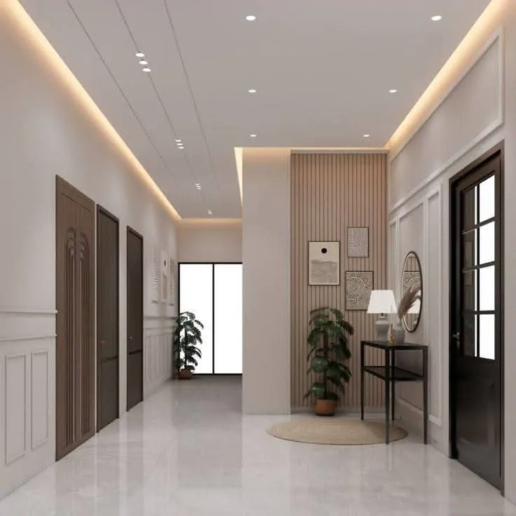 Bright hallway with white wall panel moulding, wood-slat feature wall and a lit ceiling cove